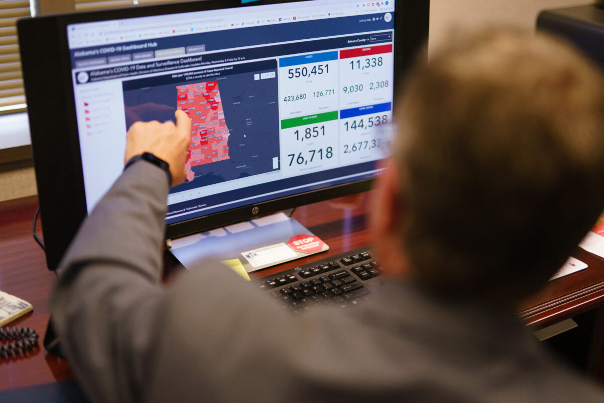 Dr. Scott Harris, Alabama’s state health officer, points at a computer screen in his office in Montgomery, Ala., on June 29, 2021. 